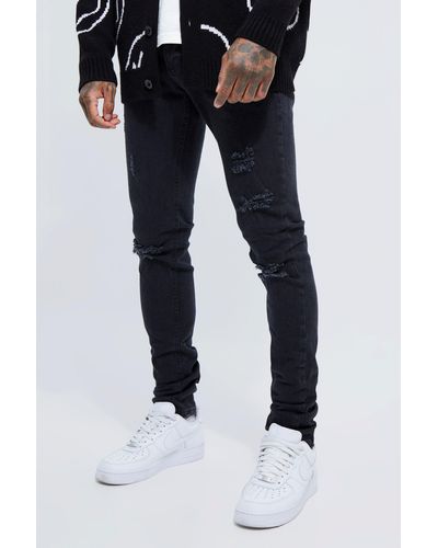 BoohooMAN Skinny Stretch Stacked Busted Knee Jeans - Blue
