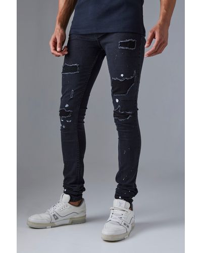 Boohoo Tall Super Skinny Jeans mit Rissen und Farbspritzern - Blau