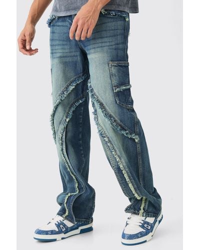 BoohooMAN Baggy Distressed Panelled Cargo Jeans In Mid Blue