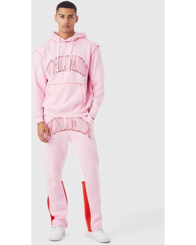 BoohooMAN Oversize Worldwide Trainingsanzug mit Kapuze - Pink
