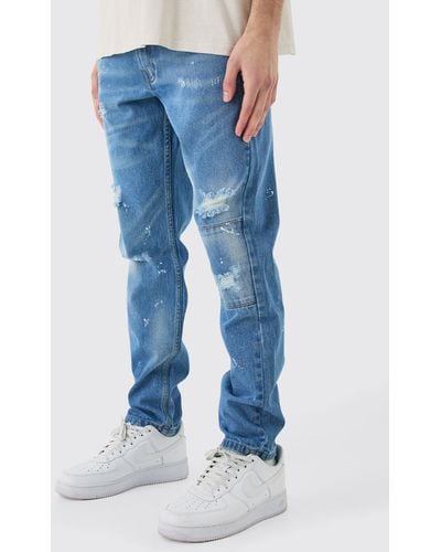 BoohooMAN Slim Rigid All Over Paint Detail Knee Ripped Jeans - Blue