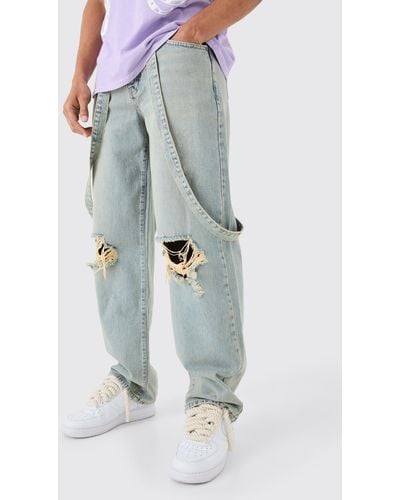 BoohooMAN Baggy Rigid Strap Detail Ripped Knee Jeans In Antique Blue
