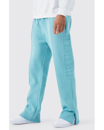 BoohooMAN Tall Relaxed Fit Split Hem Limited Embossed Jogger - Blue