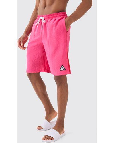 BoohooMAN Man Triangle Crinkle Board Swim Short - Pink