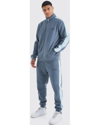BoohooMAN Slim-Fit Man Trainingsanzug mit Trichterkragen und Reißverschluss - Blau