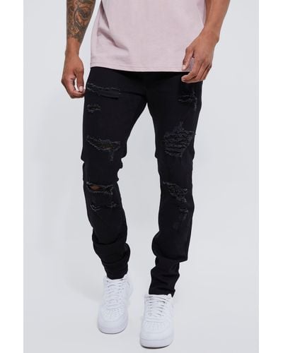 BoohooMAN Skinny Stretch All Over Rip Jeans - Black
