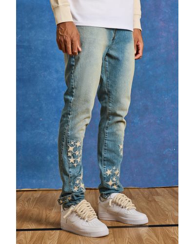 BoohooMAN Tall Slim Rigid Pu Star Applique Gusset Jeans - Blue