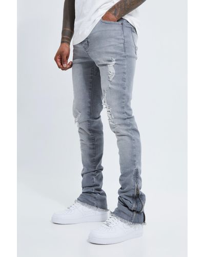BoohooMAN Skinny Stretch Stacked Zip Gusset Rip Jeans - Blue