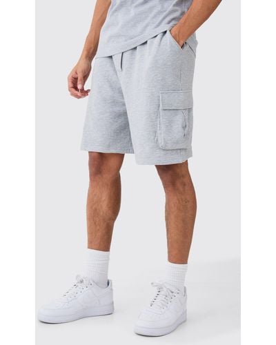 BoohooMAN Oversized Drop Crotch Cargo Pocket Jersey Shorts - Blue