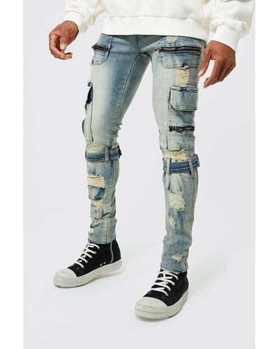 BoohooMAN Skinny Stretch Zip Multi Strap Cargo Jeans - Blue