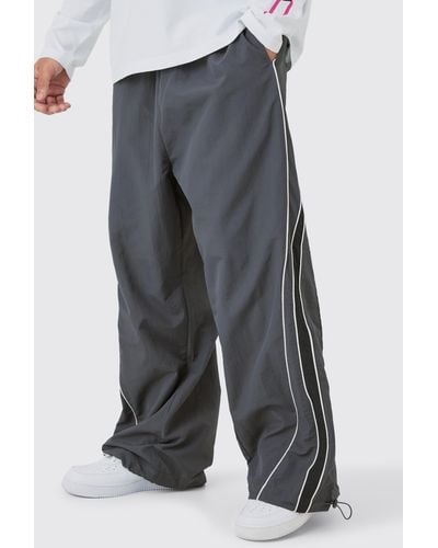 BoohooMAN Elastic Waist Piping Detail Parachute Trousers - Grey