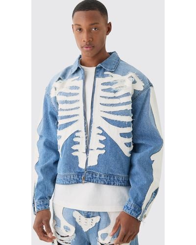 BoohooMAN Boxy Fit Skeleton Applique Distressed Denim Jacket In Light Blue - Blau
