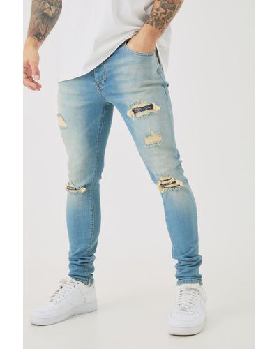 BoohooMAN Skinny Stretch Ripped Bandana Jeans In Light Blue