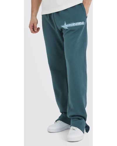 BoohooMAN Tall Jogginghose mit geteiltem Saum und Worldwide Stern Print - Grün