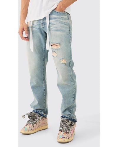 BoohooMAN Relaxed Rigid Ripped Let Down Hem Jeans With Extended Drawcords In Antique Blue