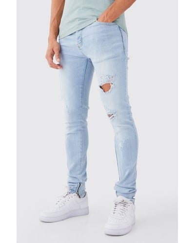 BoohooMAN Mens Skinny Stretch Stacked All Over Slash Jeans - Blue