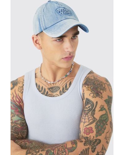 BoohooMAN Worldwide Embossed Washed Cap In Blue