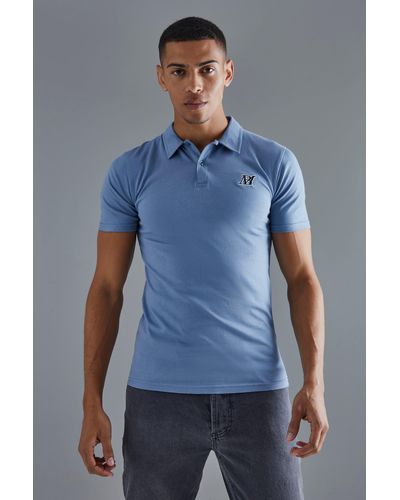 BoohooMAN Slim-Fit Poloshirt mit Man-Stickerei - Blau