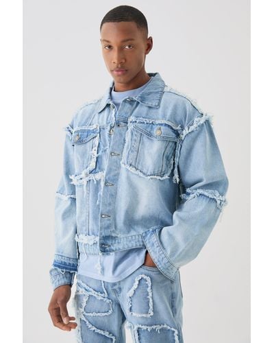 BoohooMAN Boxy Fit Distressed Patchwork Denim Jacket In Light Blue - Blau
