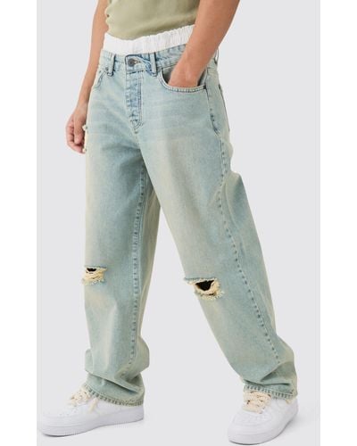 BoohooMAN Baggy Rigid Boxer Waistband Ripped Knee Jeans In Antique Blue