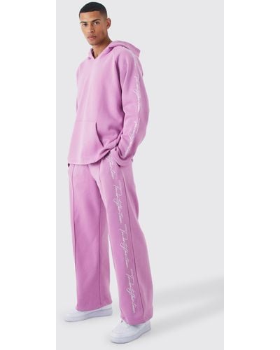 BoohooMAN Oversize Trainingsanzug mit rohem Saum und Stickerei - Pink