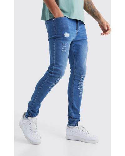 BoohooMAN Tall Skinny Jeans With All Over Rips - Blue