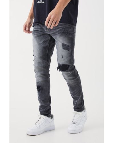 BoohooMAN Skinny Stretch Rip & Repair Self Fabric Jeans - Blue