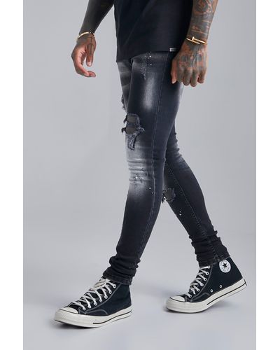BoohooMAN Super Skinny Distressed Paint Splat Jeans - Black