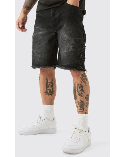 BoohooMAN Relaxed Rigid Extreme Side Ripped Denim Short In Washed Black - Schwarz