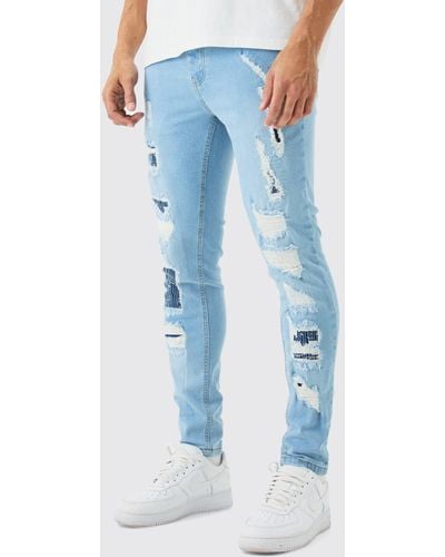 BoohooMAN Skinny Stretch All Over Ripped Light Blue Jeans