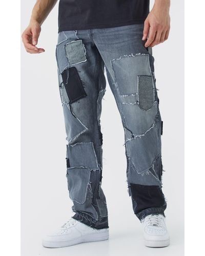BoohooMAN Relaxed Distressed Patchwork Jean - Blue