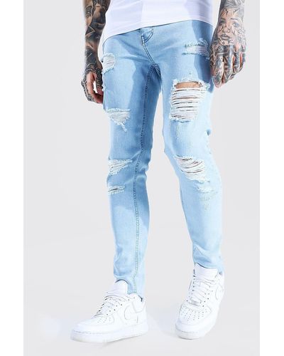 BoohooMAN Skinny Stretch All Over Rip Jean - Blue