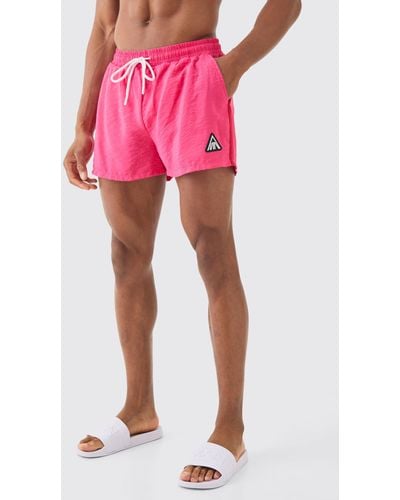 BoohooMAN Super Short Triangle Crinkle Trunks - Pink