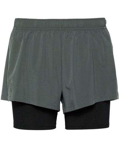 On Shoes And Black Layered Running Shorts - Gray