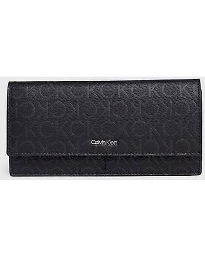 Calvin Klein Cartera grande de plegado triple con logotipo y RFID - Gris