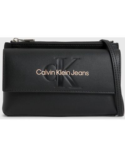 Calvin Klein Round Signature Crossbody in Brown