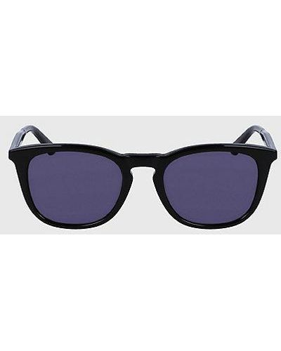 Calvin Klein Runde Sonnenbrille CK23501S - Blau