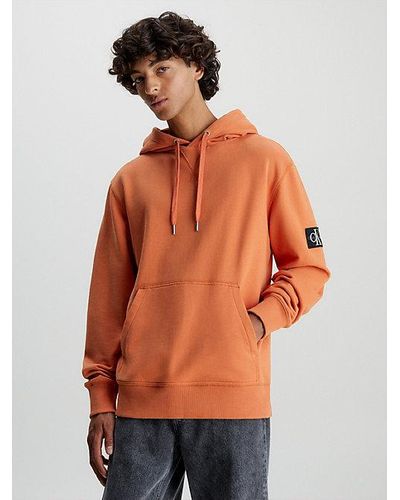 Calvin Klein Badge-Hoodie aus Baumwoll-Frottee - Orange