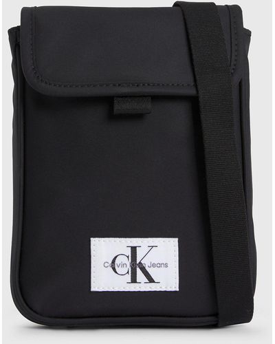 Calvin Klein Sac en bandoulière avec rangement pour téléphone - Noir
