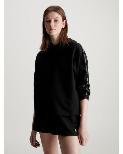 Calvin Klein Sweat-shirt à capuche relaxed avec Logo Tape - Noir