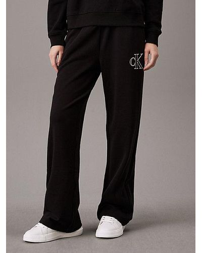 Calvin Klein Pantalón de chándal con monograma y pierna ancha - Negro