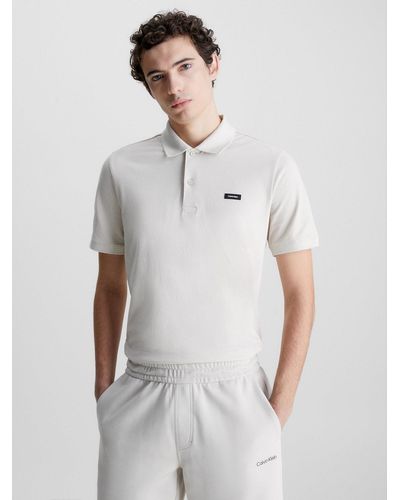 Calvin Klein Polo slim en piqué élastique - Blanc