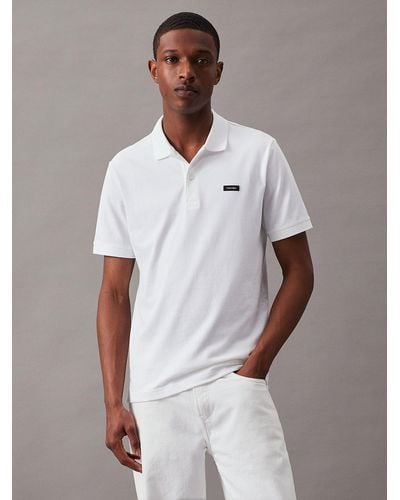Calvin Klein Polo slim en piqué élastique - Blanc