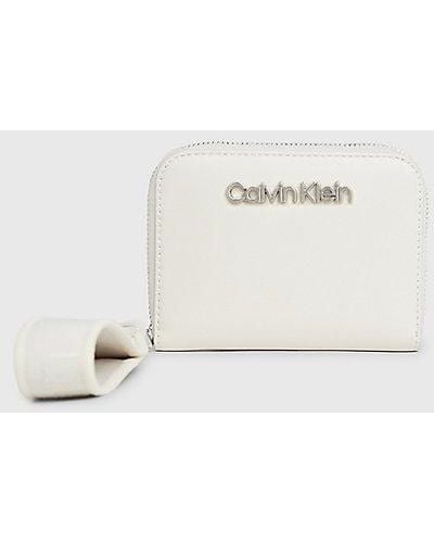 Calvin Klein Cartera con cremallera en el contorno y correa para la muñeca RFID - Neutro