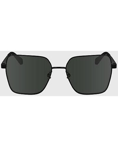 Calvin Klein Quadratische Sonnenbrille CKJ24201S - Schwarz