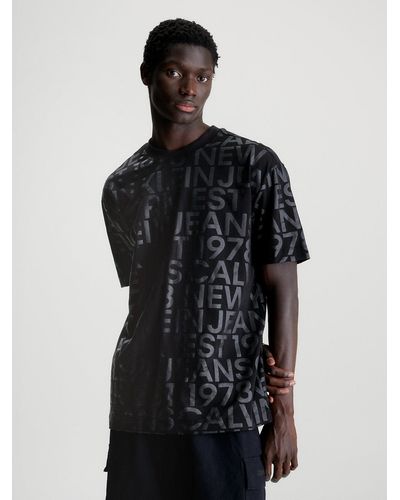 Calvin Klein T-shirt entièrement imprimé de logos - Noir