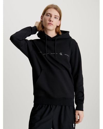 Calvin Klein Sweat-shirt à capuche avec répétitions de logos - Noir