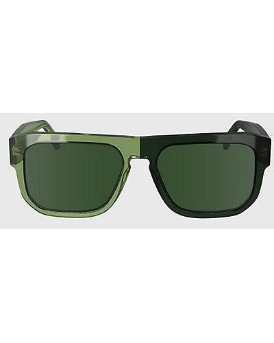 Calvin Klein Modifizierte rechteckige Sonnenbrille CKJ24607S - Grün