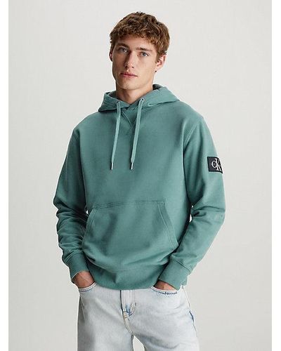 Calvin Klein Badge-Hoodie aus Baumwoll-Frottee - Blau