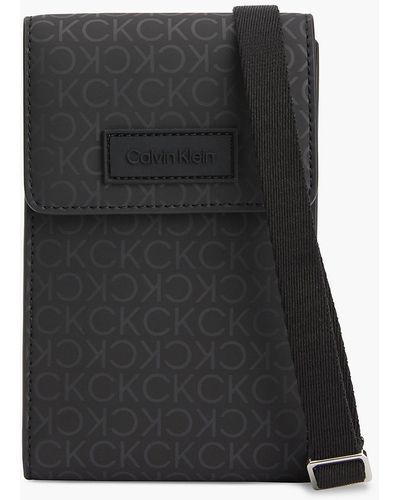 Calvin Klein Sac en bandoulière avec logo et rangement pour téléphone - Noir